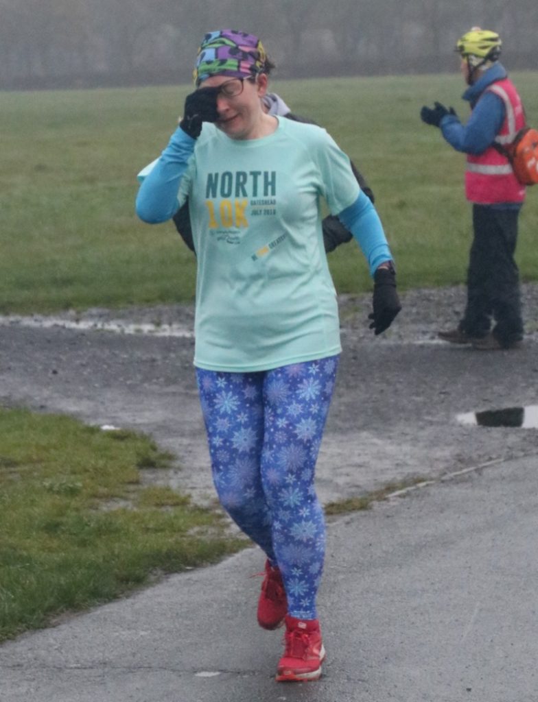 Wiping rain off glasses during parkrun